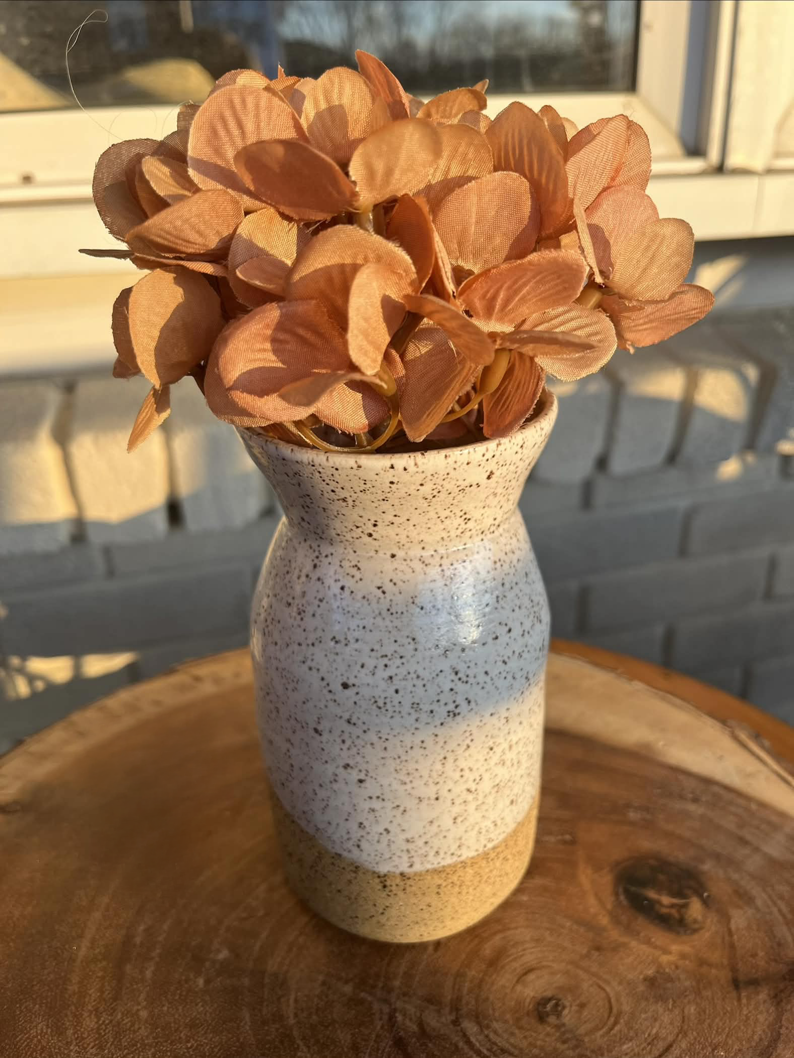 Speckled ceramic and white vase
