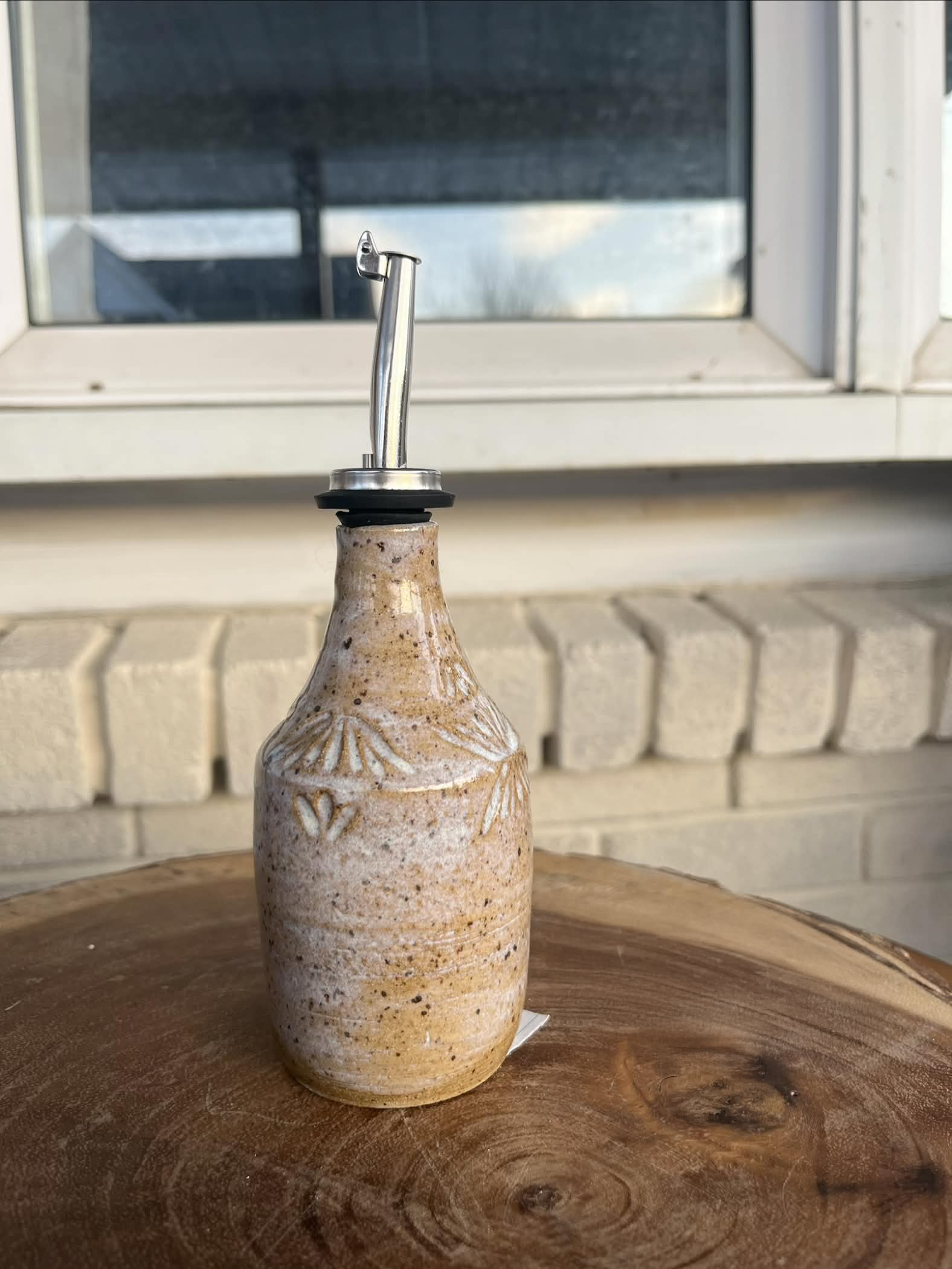 Earthy white and ceramic oil bottle